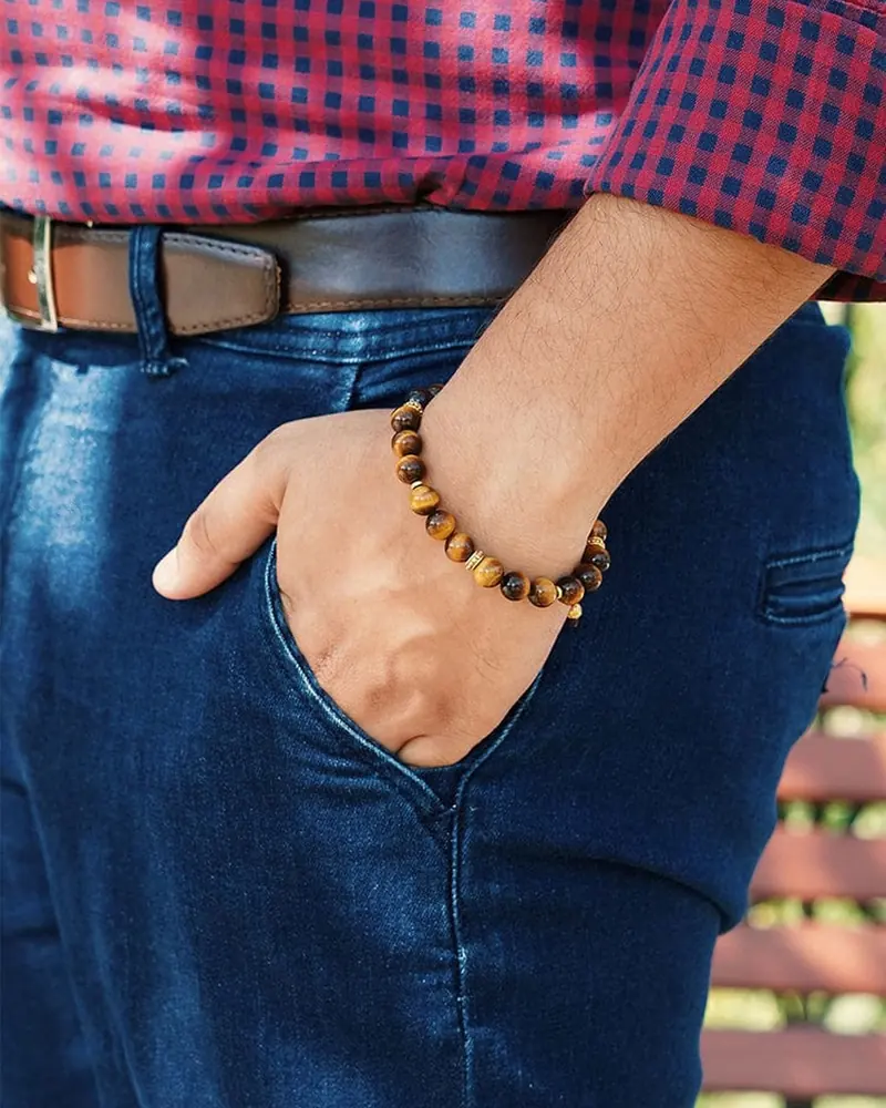 A tiger's eye bead bracelet worn on a wrist