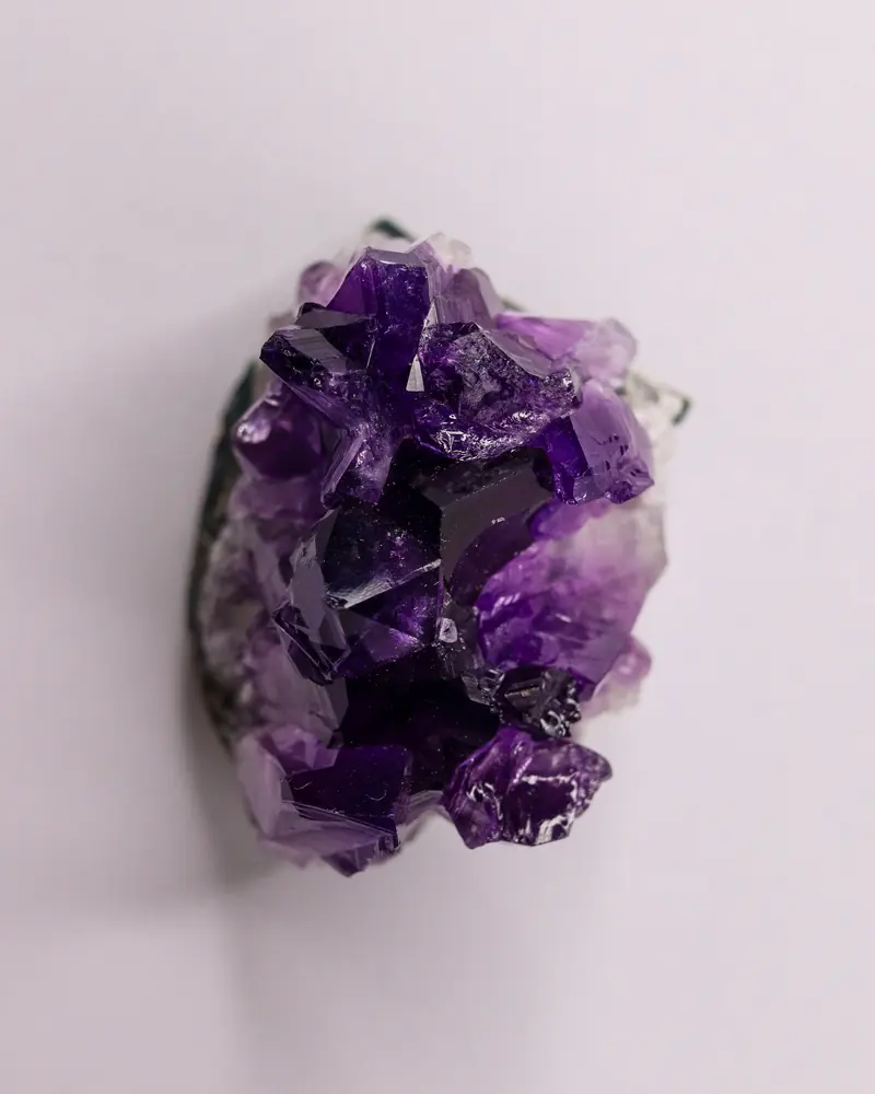 A raw amethyst cluster with deep purple crystal points