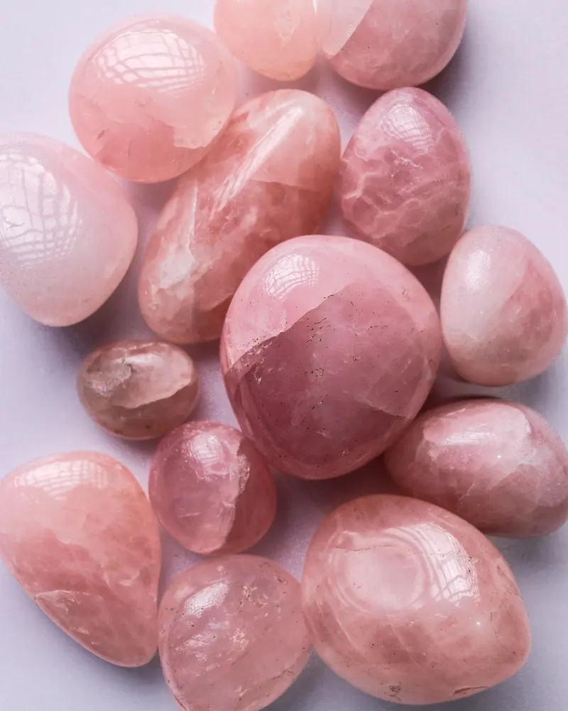 Polished tumbled rose quartz stones